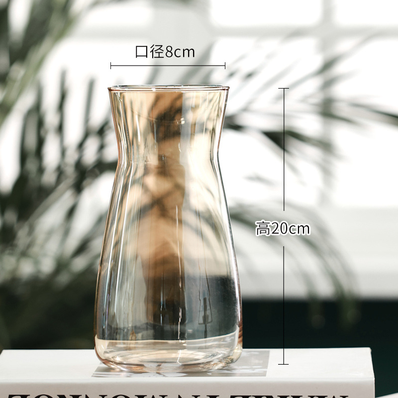 Modern clear glass vase with curved hourglass shape for contemporary home décor