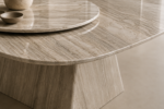 Modern marble dining table with rotating Lazy Susan, sculptural marble pedestal base, and luxury contemporary design.