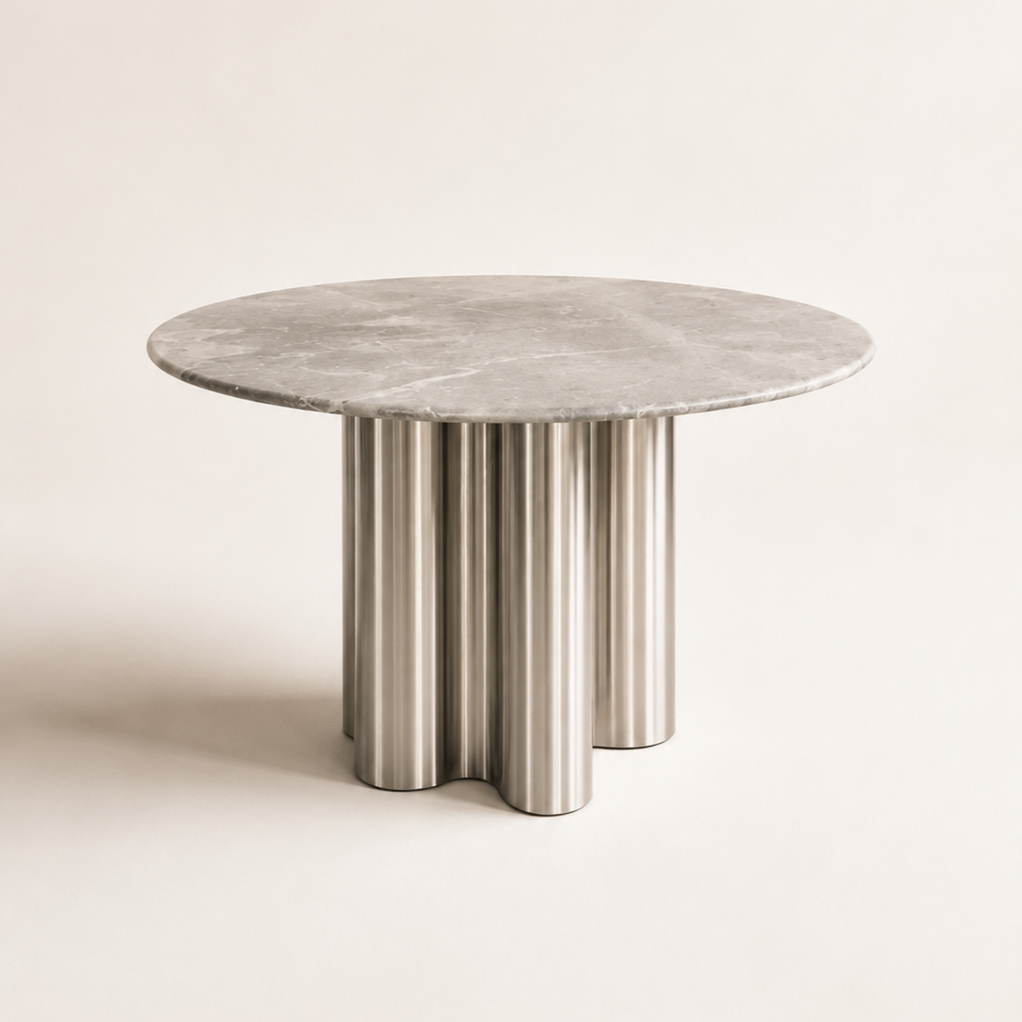 dining table 1 Modern round marble dining table with premium marble tabletop and stainless steel cylindrical pedestal base for contemporary dining rooms.