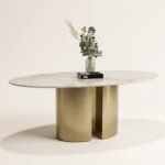 Odessa marble oval dining table, top-down view styled with dried branch centerpiece