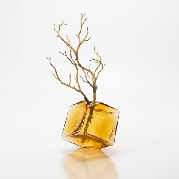 Faceta amber glass vase with sculptural branch, faceted geometric form