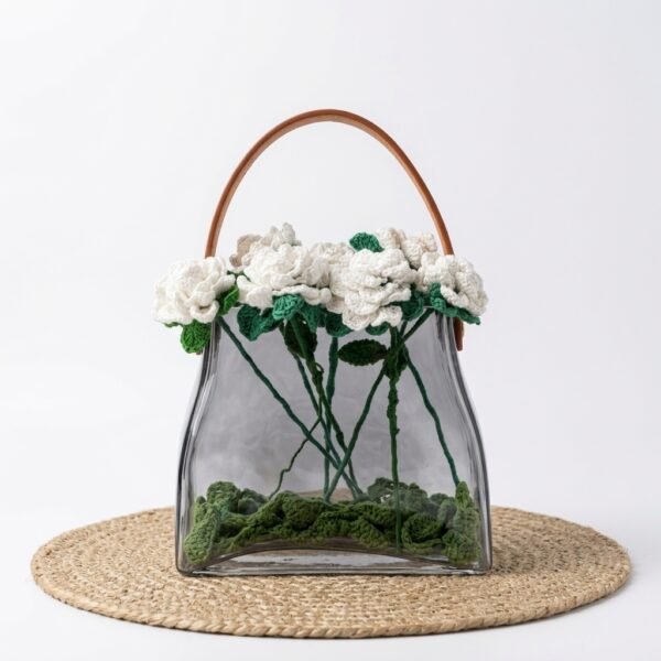 Marlo glass handbag vase with leather handle, styled with crochet floral arrangement