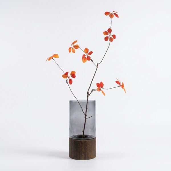 Alder smoked glass cylinder vase with wood base, styled with branch arrangement