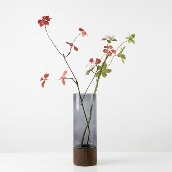 Alder smoked glass cylinder vase with wood base, styled with branch arrangement