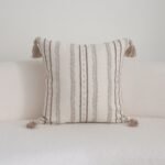 Close-up of soft tufted greige and taupe stripes on Linden cushion