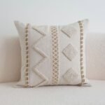 Woven lattice centre band and braided trim detail on Atlas cushion